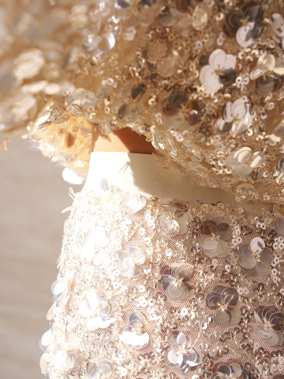 Close-up of a person wearing the Social Queen Beaded Sequin Mermaid Elastic Skirt, featuring reflective circular sequins and a beige waistband.