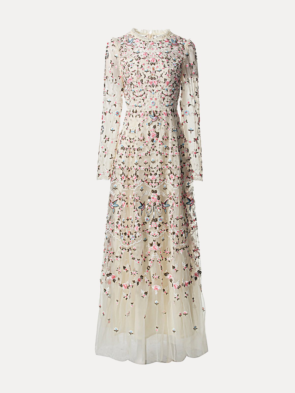 The Floral Embroidered Mesh Dress by Social Queen features long sleeves, floor-length cream mesh with colorful floral embroidery, and sheer tulle panels—an elegant choice for a wedding guest.