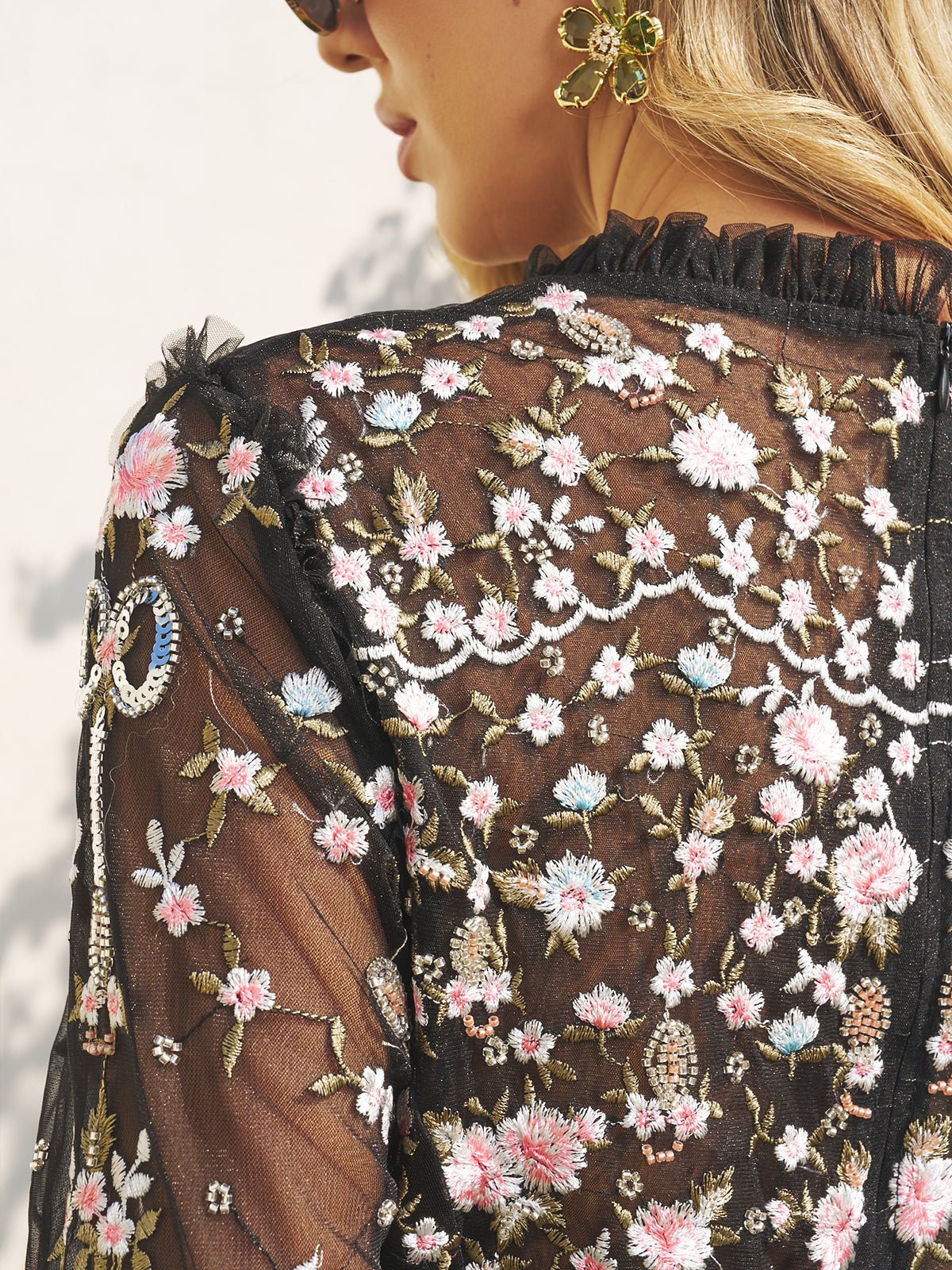 Close-up of the Social Queen Floral Embroidered Mesh Dress, featuring sheer tulle panels with pink, white, and green thread—a stylish choice for wedding guests.