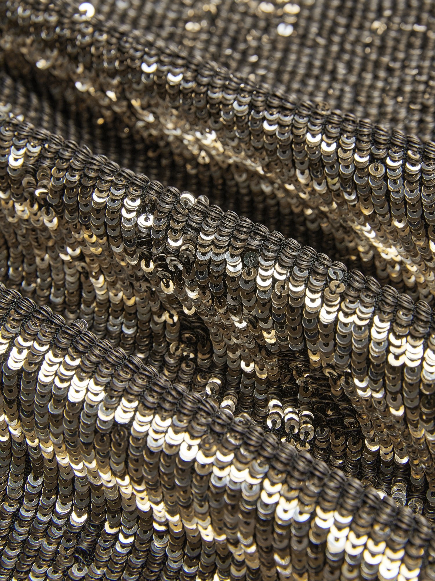 Close-up view of the Social Queen Pearl-Trim Sequin Fringe Skirt, featuring hand-applied gold sequins for a textured, reflective finish.