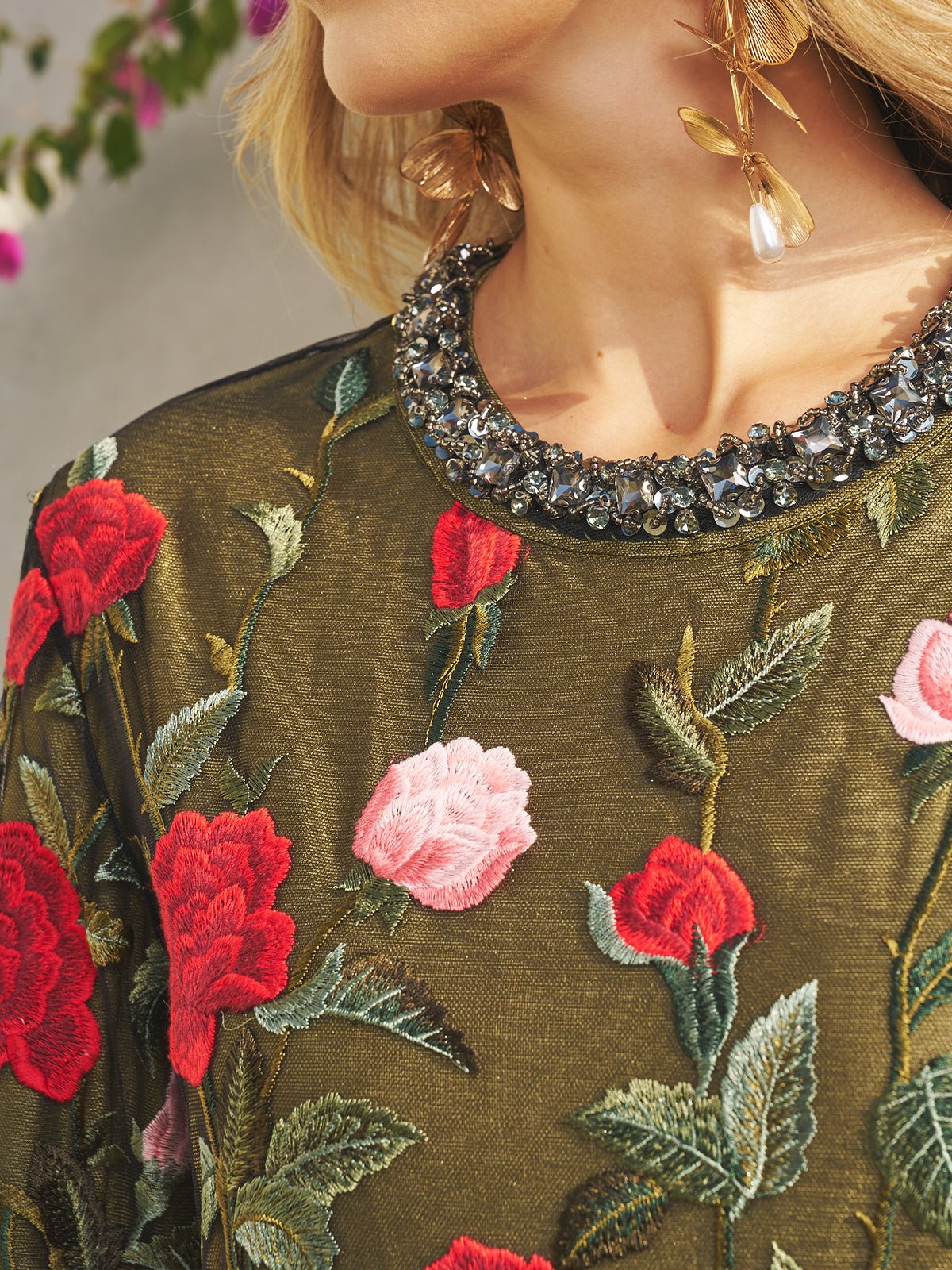 A person in the Social Queen Rose Embroidered Beaded A-Line Dress with gold leaf earrings creates an elegant wedding guest look.