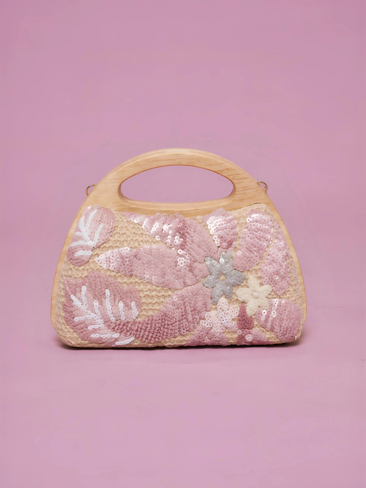 The Social Queen Sequin Embroidered Wooden Handle Bag features a straw-effect design with pink and white floral sequin embroidery on a solid pink background.