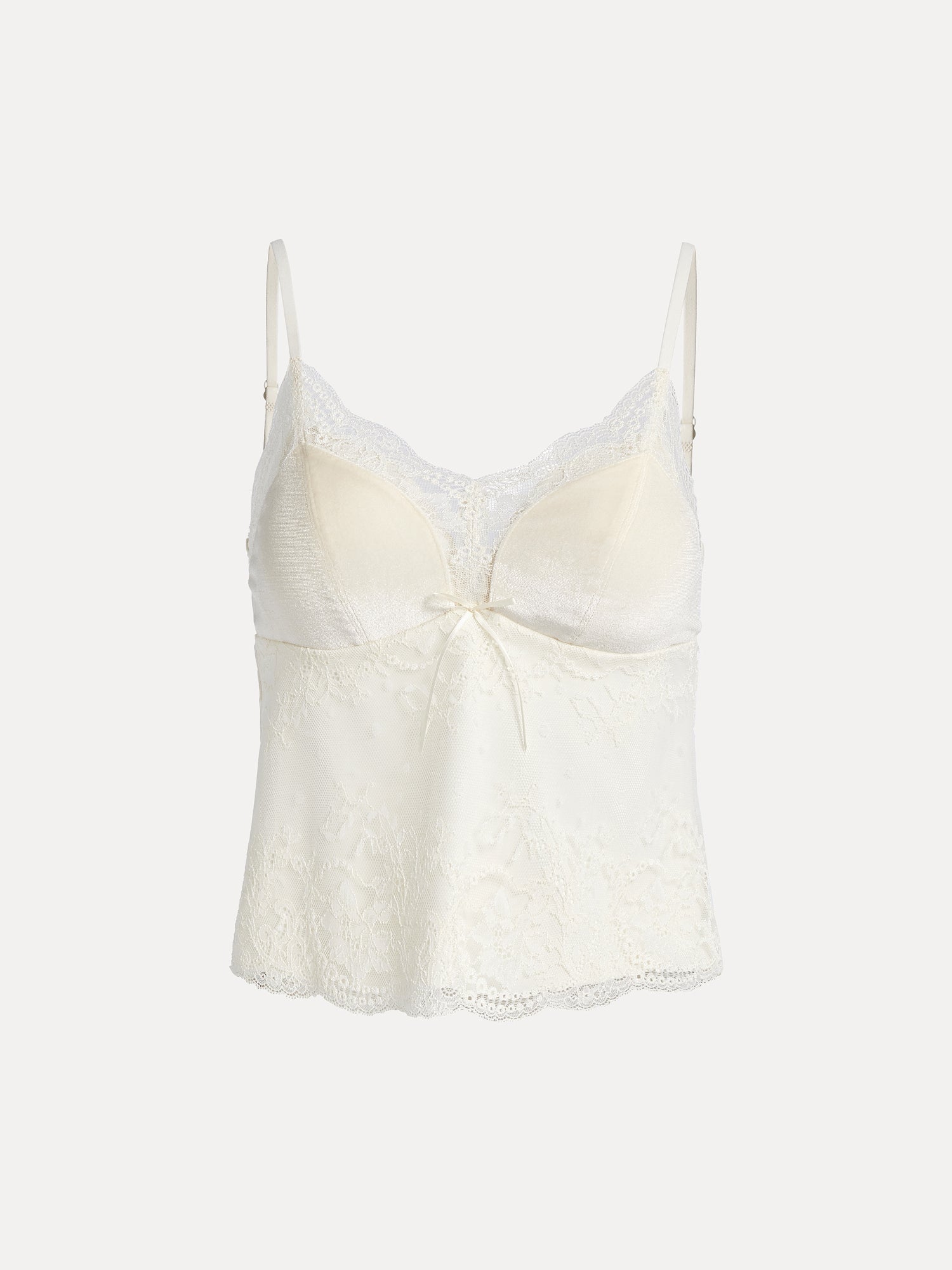 The Social Queen Stretch Velvet Camisole features embossed lace, a vintage-inspired scalloped neckline, adjustable straps, front bow detail, and a slightly flared hem.