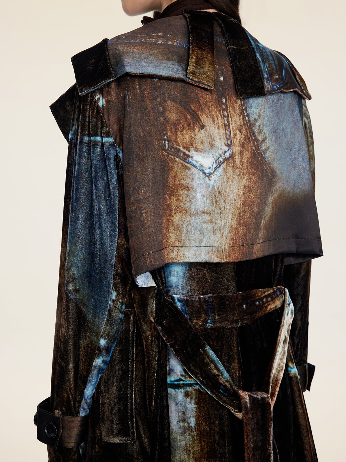 A person wearing the Social Queen Velvet Gradient Tie-Waist Trench Coat, featuring a printed design that mimics the faded back of a denim jacket, seen from behind.