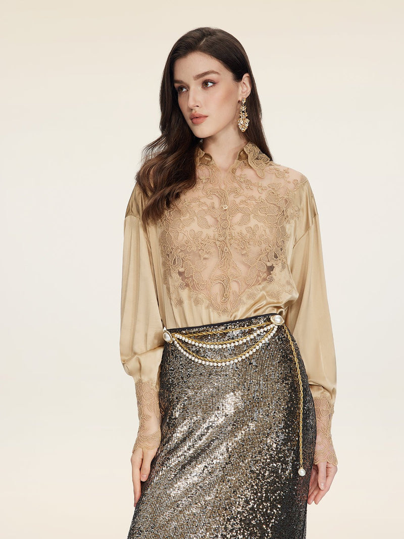 A woman in a Social Queen 100% Silk Embroidered Lace Satin Blouse, pairing it with a metallic sequin skirt and a gold chain belt, poses against a plain light background.