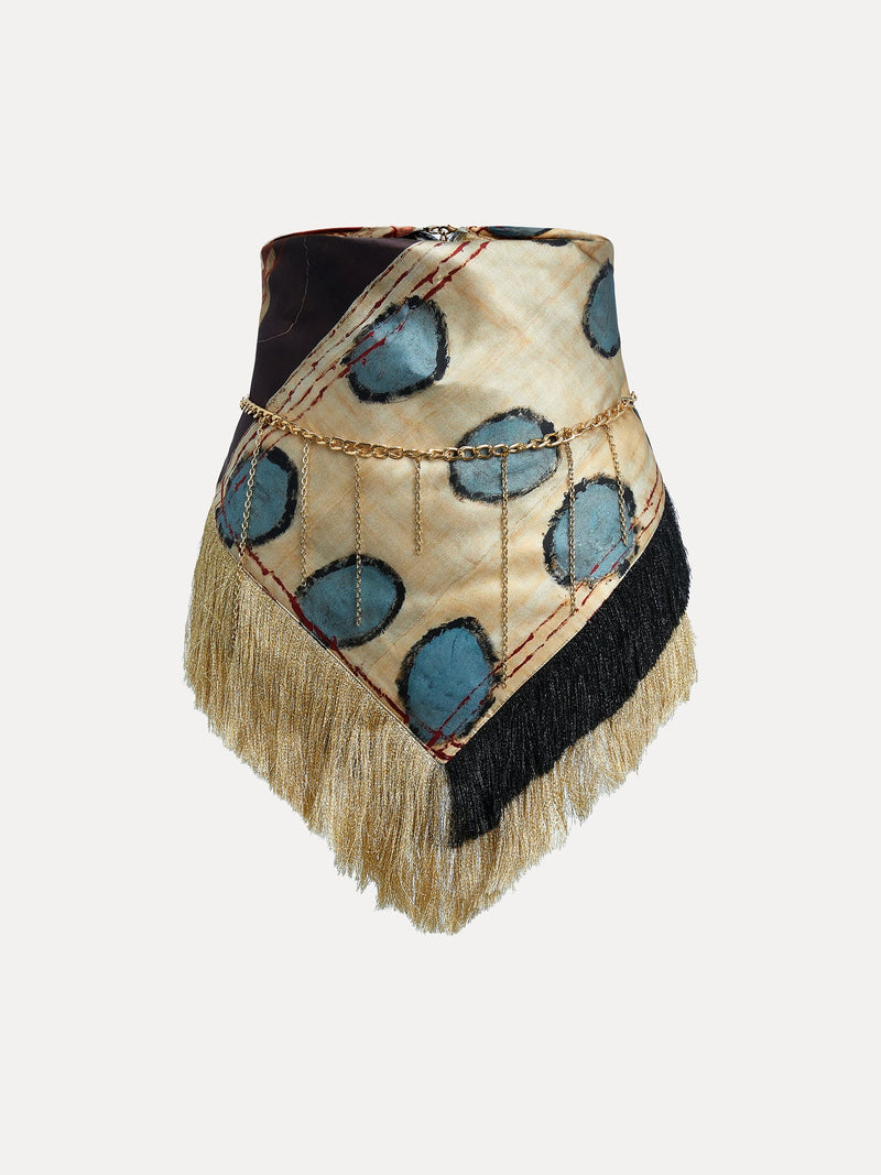 The Social Queen 100% Silk Print Tassel Chain Belt features blue circular patterns, a gold-tone chain, and elegant gold and black tassels, shown against a white background.