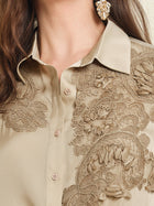 Close-up of the Social Queen 100% Silk Retro Floral Appliqué Satin Blouse, featuring intricate 3D florals in beige, styled with long brown hair and gold statement earrings for a French vintage-inspired look.