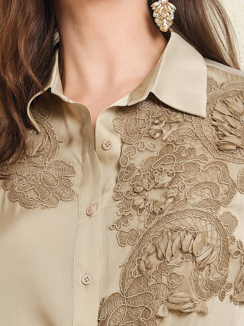 Close-up of the Social Queen 100% Silk Retro Floral Appliqué Satin Blouse, featuring intricate 3D florals in beige, styled with long brown hair and gold statement earrings for a French vintage-inspired look.