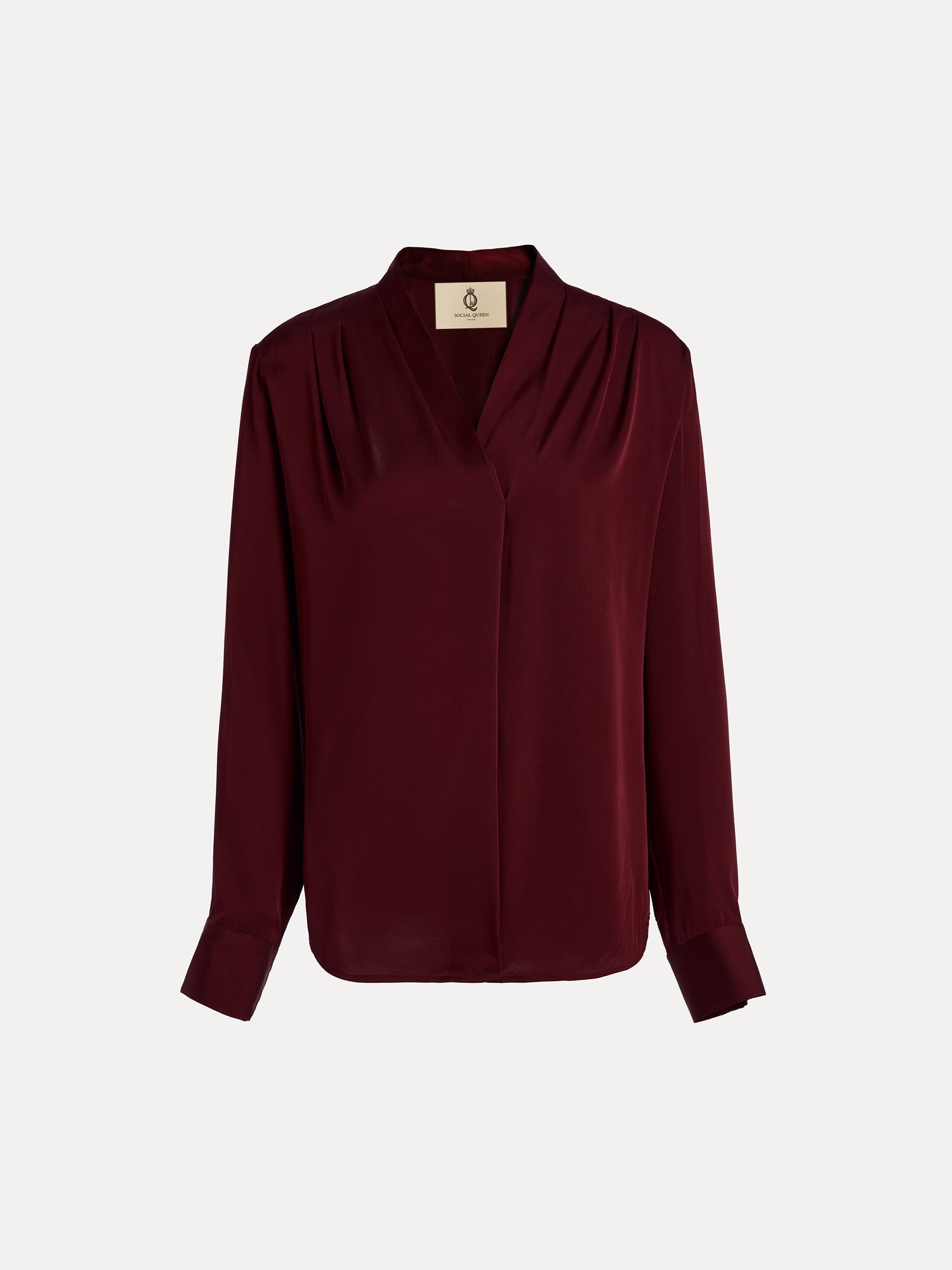 The Social Queen 100% Silk Satin Wrap V-Neck Blouse in burgundy features long sleeves, pleated shoulders, buttoned cuffs, and a cross-front design. Shown on a plain white background, it's ideal for versatile styling.