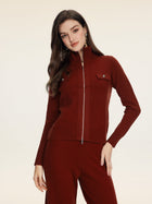 A woman wears the Social Queen 100% Wool Knit Jacket—ribbed, long-sleeve, maroon, with hand-optimized zippers and chest pockets—paired with matching pants against a plain light background.