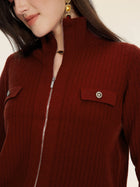 A person wearing the Social Queen 100% Wool Knit Jacket, featuring a ribbed knit texture, dark red color, flap pockets, hand-optimized zippers, metallic buttons, and gold earrings.