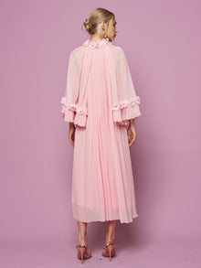 A woman faces away against a pink background, wearing the Social Queen 3D Floral Embellished Silk Dress in pink.