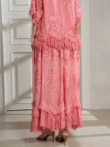 A person wearing the Social Queen 3D Floral Embroidered 100% Silk Ruffle Skirt stands indoors on a tiled floor, facing away from the camera.