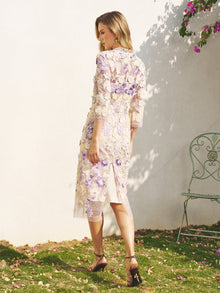A woman wears the Social Queen 3D Floral Embroidered Beaded Dress, featuring cheongsam-inspired design, 3D floral appliqué, and hand-placed beads.