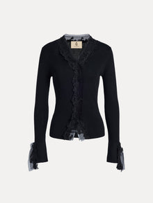 The Social Queen 3D Floral Lace Wool-Silk Knit Top is a black long-sleeve cardigan featuring 3D floral lace and ruffled lace cuffs along the front opening, shown on a plain white background.