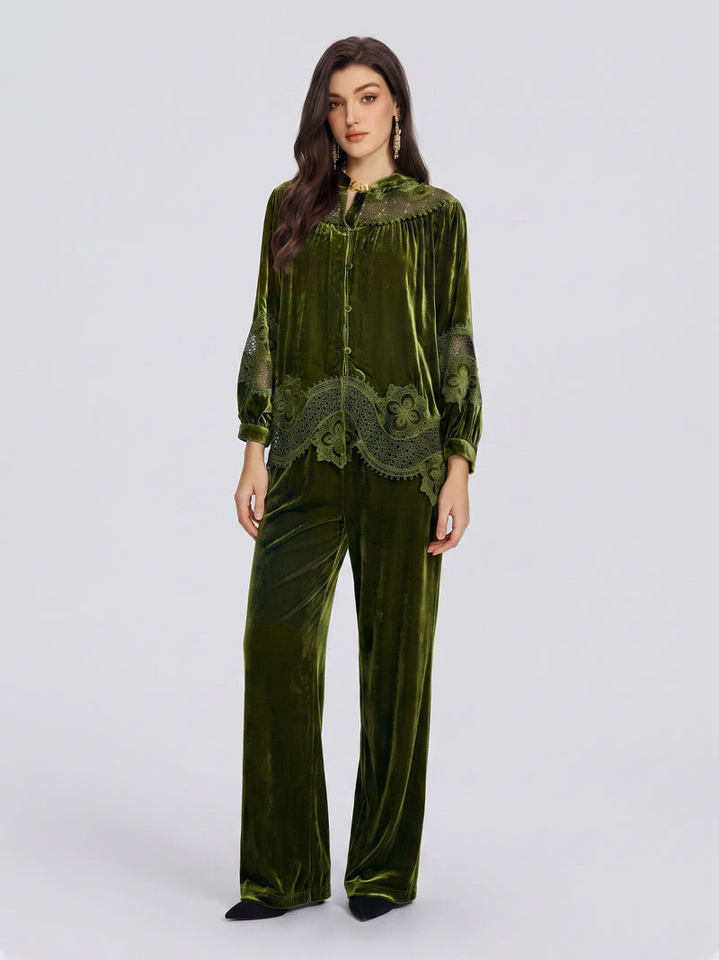 A woman wears the Social Queen 100% Silk Velvet Lace-Panel Blouse in green, paired with matching pants and set against a plain light gray background—a vintage-inspired look that makes a perfect stylish option for wedding guests.