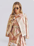 A woman wearing the Social Queen Embroidered Jacquard Lace-Trimmed Jacket and a matching dress, with long wavy hair, sunglasses, and jewelry, stands against a plain background.