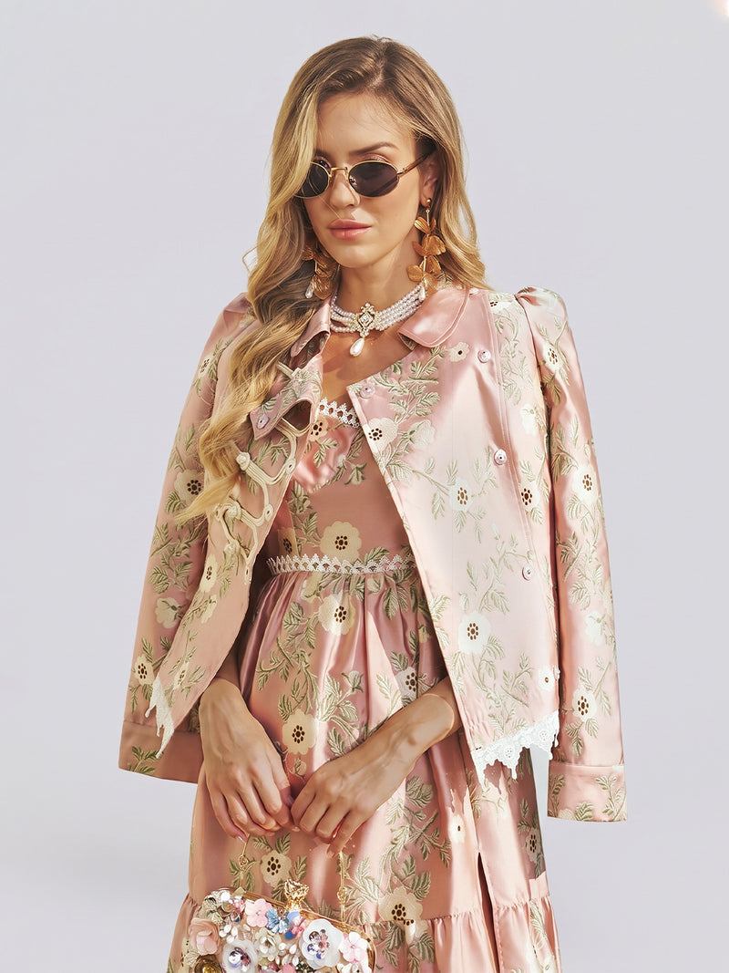 A woman wearing the Social Queen Embroidered Jacquard Lace-Trimmed Jacket and a matching dress, with long wavy hair, sunglasses, and jewelry, stands against a plain background.