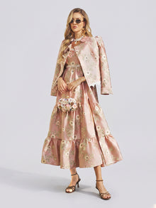 A woman wearing the Social Queen Embroidered Jacquard Ruffle Lace-Trim Dress with a matching jacket, accessorized with a small floral purse, sunglasses, and heeled sandals, stands against a plain light background.