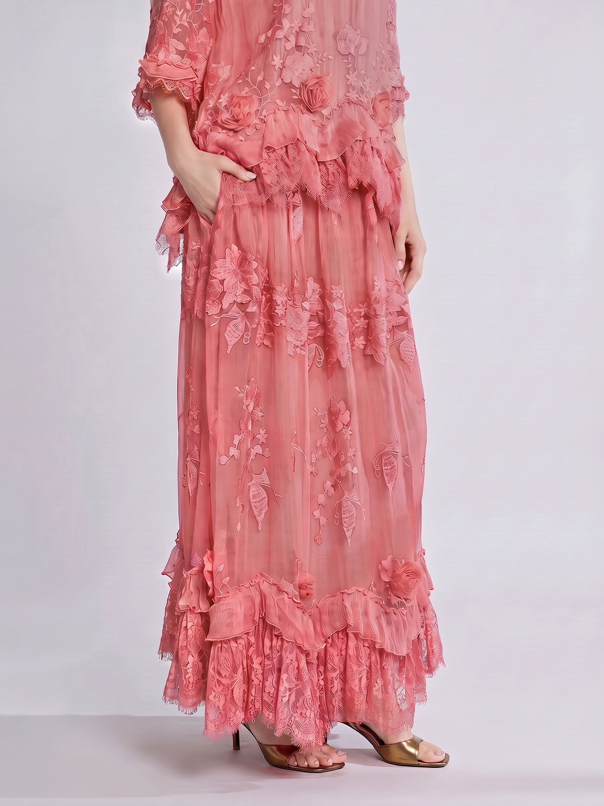 A person stands against a pale background in open-toe heels, wearing the Social Queen 3D Floral Embroidered 100% Silk Ruffle Skirt, which features intricate floral embroidery, delicate ruffled hems, and an elegant A-line silhouette.
