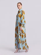 Social Queen Floral Print Maxi Shirtdress in light blue with a long-sleeved, relaxed silhouette and tie waist.