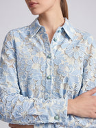 Social Queen Floral Lace Cropped Jacket in light blue and white, featuring long sleeves and an all-over appliqué pattern.