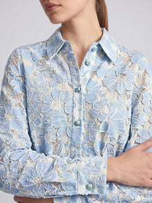 Social Queen Floral Lace Cropped Jacket in light blue and white, featuring long sleeves and an all-over appliqué pattern.