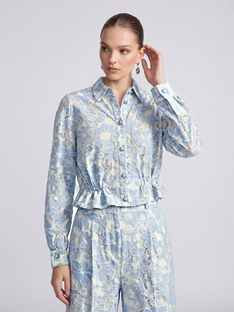 Social Queen Floral Lace Cropped Jacket in blue and cream with long sleeves, a button-front closure, and a ruffled waist.