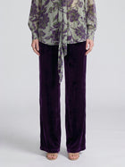Deep purple Velvet Wide-Leg Pants by Social Queen with a straight-cut, wide-leg fit and elasticated waistband, paired with a sage green floral print blouse.