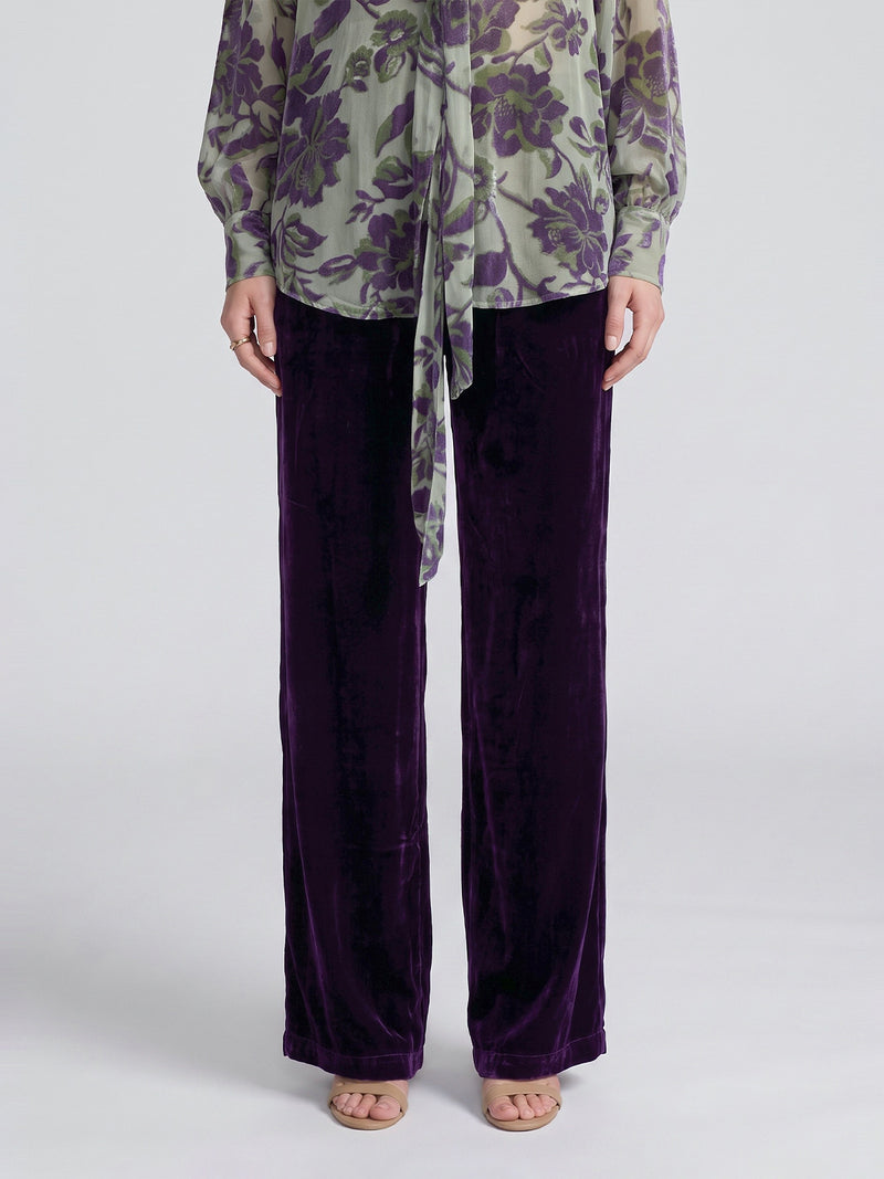 Deep purple Velvet Wide-Leg Pants by Social Queen with a straight-cut, wide-leg fit and elasticated waistband, paired with a sage green floral print blouse.