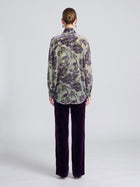 A person seen from behind wears a green, sheer long-sleeved shirt with a purple floral print and purple Velvet Wide-Leg Pants.