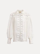 The Beaded Geometric Lace Blouse by Social Queen features vintage-inspired white lace, a high collar, buttoned front, wide cuffs, and elegant lantern sleeves for a timeless look.