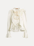 The Beaded Ruffle Satin Blouse by Social Queen features a cream satin finish, puff sleeves, hand-stitched ruffles, lace accents, a high collar, and flared cuffs.