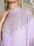 A close-up shows a person in the Social Queen Beaded Tulle Caftan Cape Dress, featuring delicate beads and silver sequins, paired with matching earrings and manicured nails.