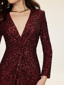 A person wearing the Social Queen Burgundy Sequin V-Neck Slit Dress with a gold chain necklace.
