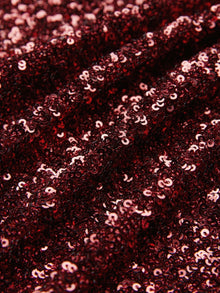 Close-up of the Social Queen Burgundy Sequin V-Neck Slit Dress, highlighting its shimmering sequins and graceful folds for a sophisticated evening look.