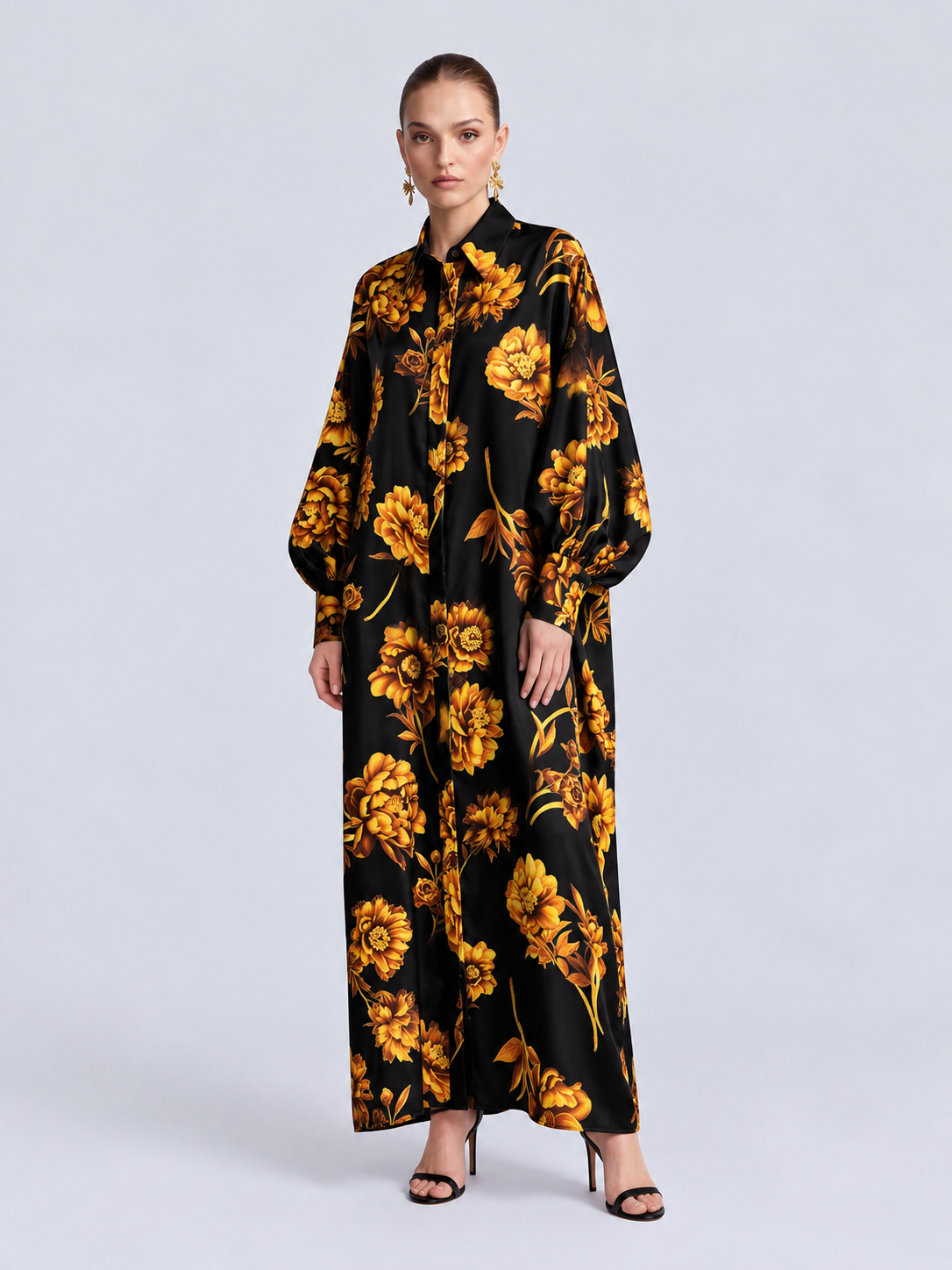 Social Queen Floral Print Maxi Shirtdress in black, a long-sleeved, floor-length floral print dress with a relaxed silhouette, worn with black strappy heels.