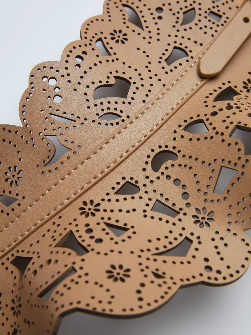 Close-up of the Social Queen Carved Leather Boho Cutout Belt, showcasing tan leather with intricate laser-cut floral and geometric patterns, scalloped edges, and detailed stitching.