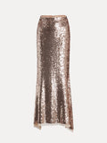 The Champagne Sequin Mermaid Skirt by Social Queen features a long, fitted silhouette with rose gold sequins and a slight flare at the hem, shown against a plain white background.