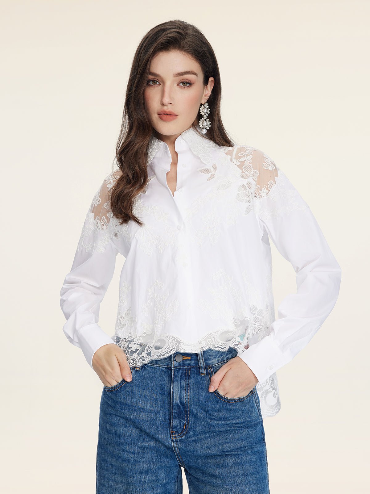 A woman wears the Social Queen Cropped Embroidered Lace Panel Blouse with blue jeans, standing against a plain light background.
