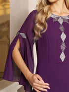 A woman wears the Social Queen Elegant Beaded Split-Sleeve Dress—a purple cocktail evening dress with glittery silver embellishments and slit bell sleeves—while resting her hand on a ledge.
