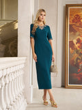 A woman stands indoors by a white balustrade and large framed painting, wearing the Social Queen Elegant Rhinestone-Embellished Dress in teal with a fitted knee-length silhouette and sparkling neckline, paired with a small handbag.
