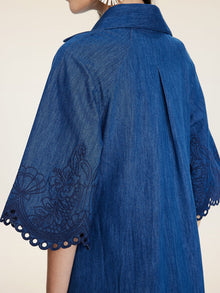 Close-up of a person wearing the Social Queen Embroidered Jacquard Denim Dress, featuring wide sleeves, jacquard embroidery, and scalloped edges for a relaxed fit.
