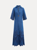 The Social Queen Embroidered Jacquard Denim Dress features a blue midi A-line silhouette, elbow-length flared sleeves, V-neck with collar, and jacquard embroidery on the hem and sleeve edges.