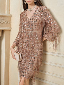 A woman wears the Social Queen Embroidered Sequin Tassel Mini Dress—knee-length, rose gold with hand-embroidered sequins—and holds a matching clutch; her face is partially out of frame.