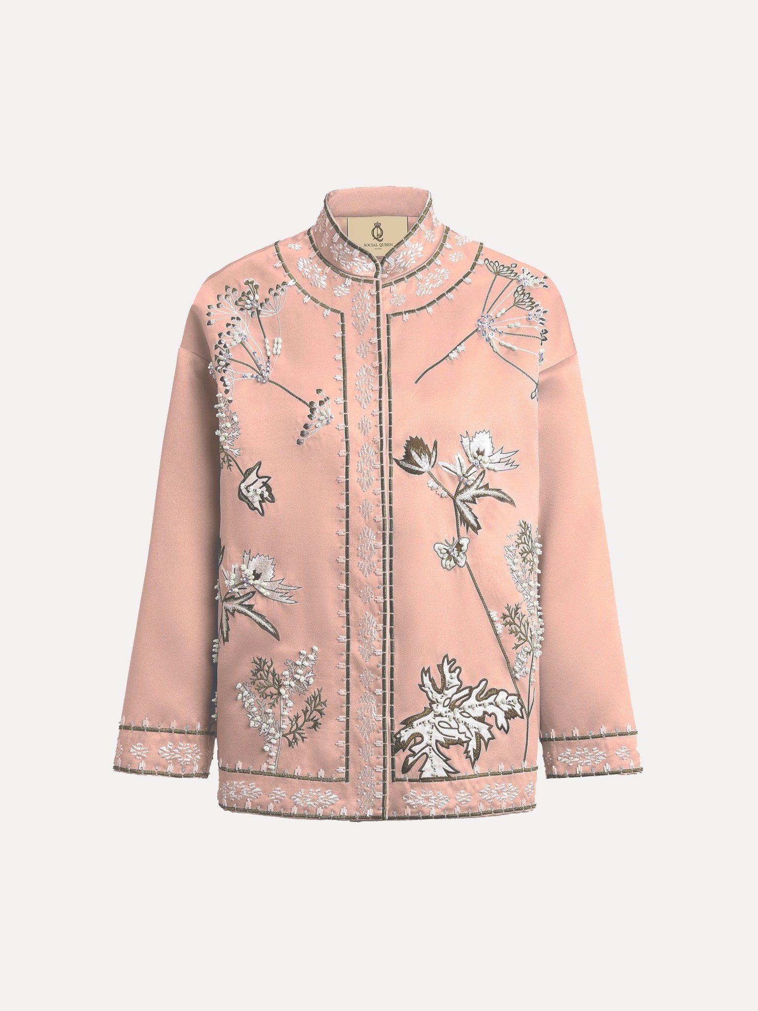 The Floral Embroidered Beaded Jacket by Social Queen features a light pink, long-sleeved stand collar design with white and black hand-embroidered floral motifs and decorative edge trim.
