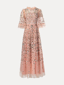The Social Queen Floral Embroidered Beaded Tulle Dress is a floor-length pink sheer dress featuring floral embroidery, a ruffled high neck, and sheer puff sleeves with ruffle trim.