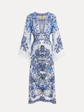 The Social Queen Floral Embroidered Lantern Sleeve Dress features blue and white florals, flared sleeves, lace trim, and intricate detailing, perfect for resort wear and shown on a plain background.