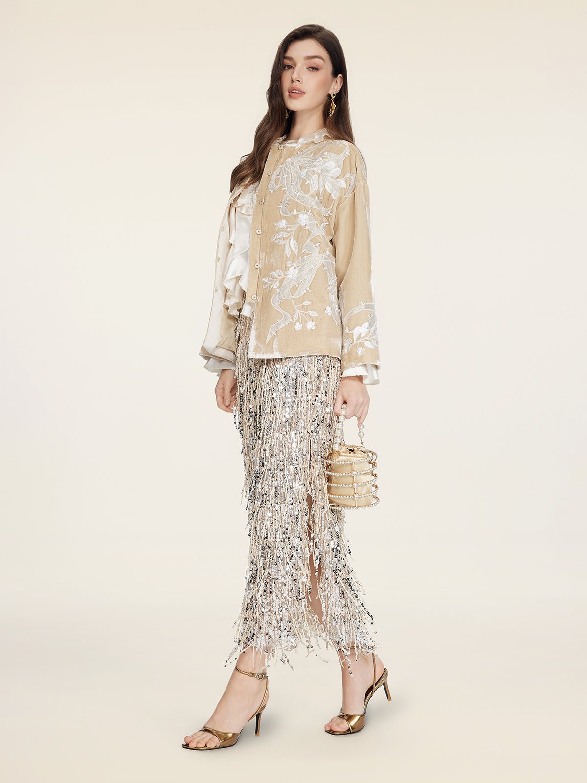 A woman stands against a plain light background wearing the Social Queen Floral Embroidered Velvet Jacket.