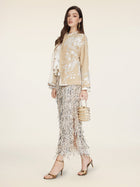 A woman stands against a plain light background wearing the Social Queen Floral Embroidered Velvet Jacket.